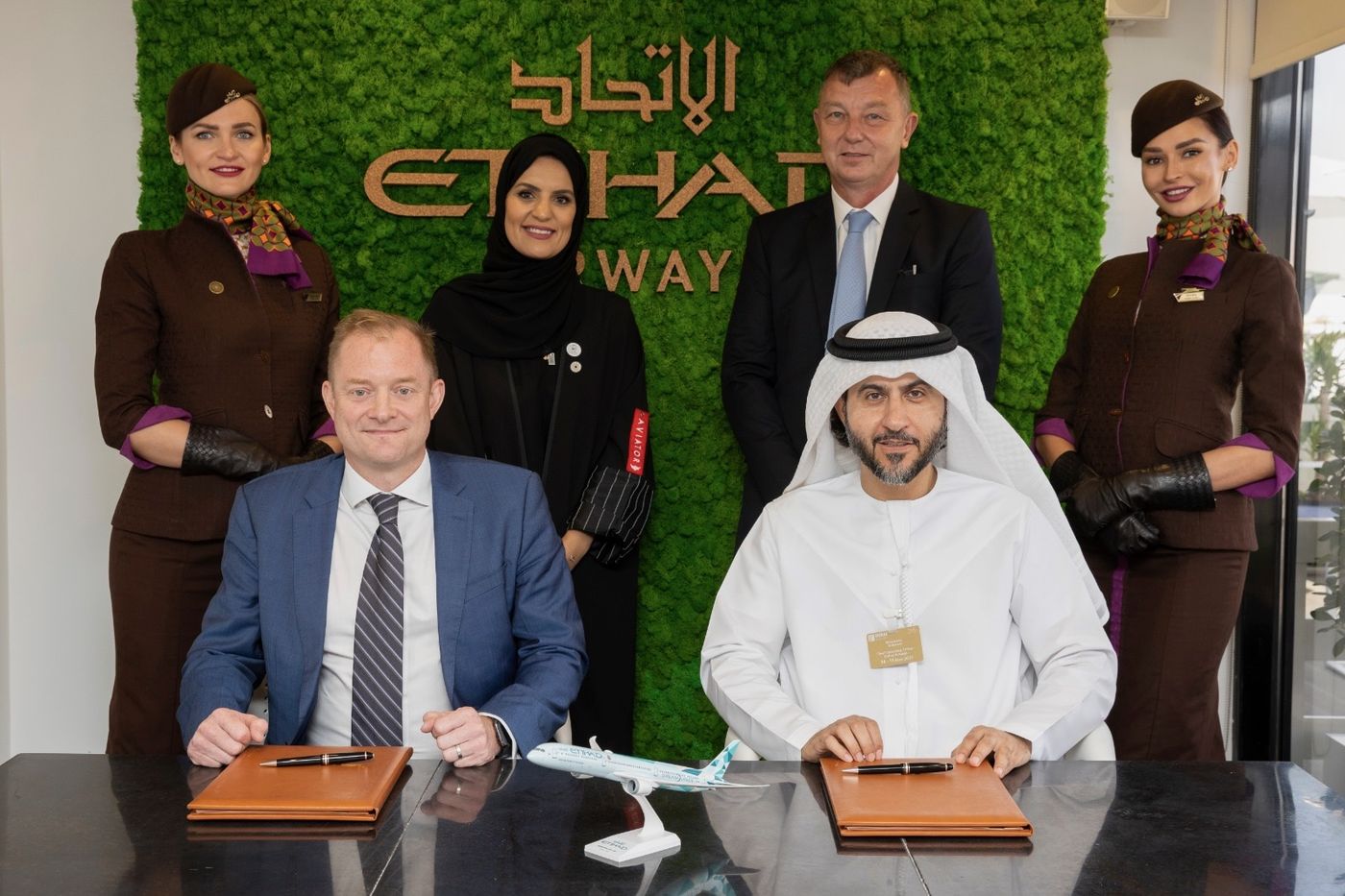 Adam signing an agreement with Etihad Airways at the Dubai Airshow